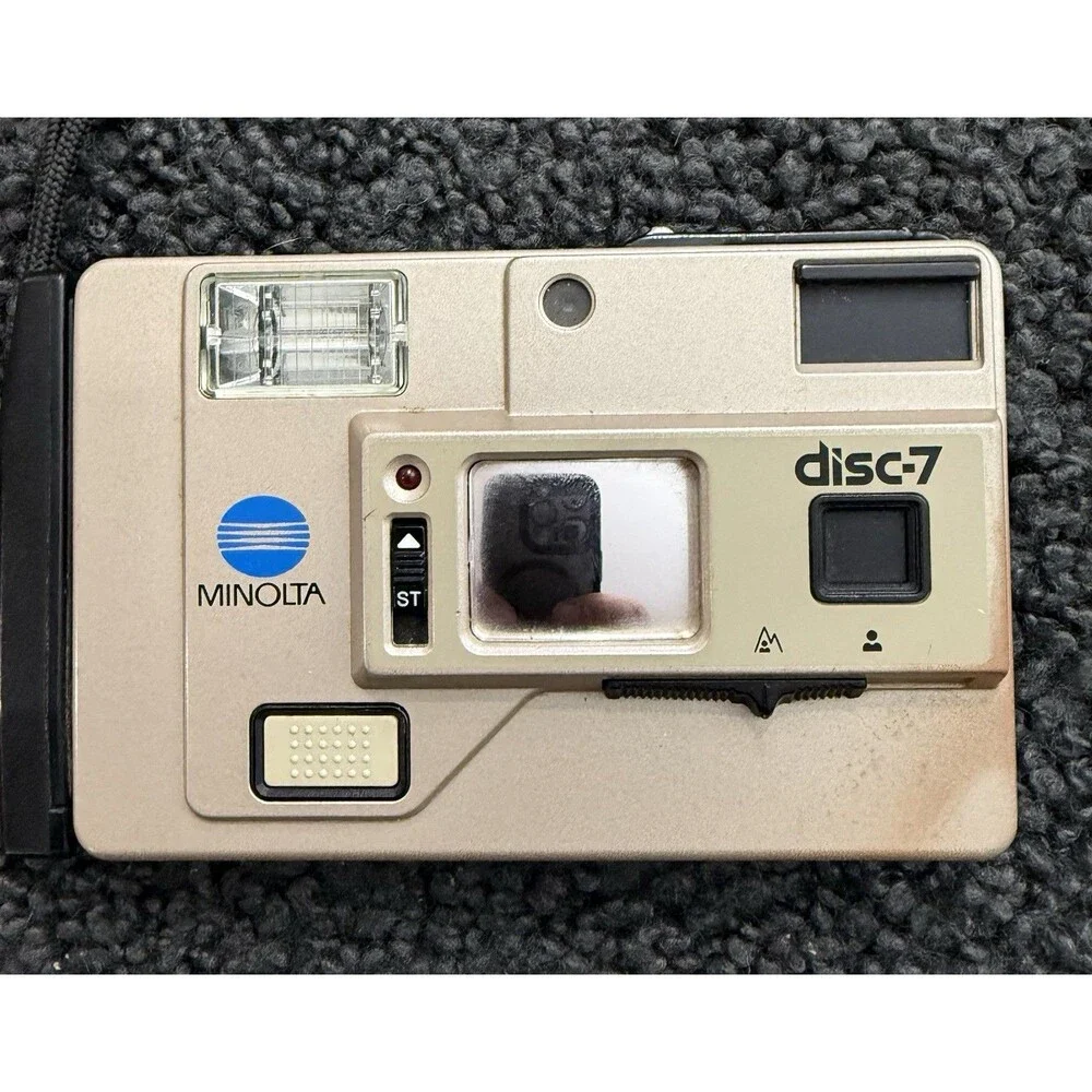1983 Minolta Disc-7 Selfie Mirror Compact Disc Film Camera